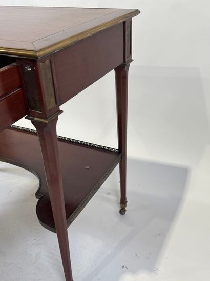 Small mahogany and brass fillet desk on casters,...