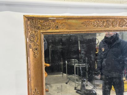 Wood and gilded stucco mirror with foliate...