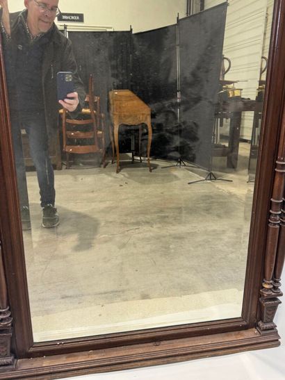 Large molded and carved walnut mirror with...