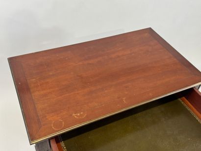 Small mahogany and brass fillet desk on casters,...