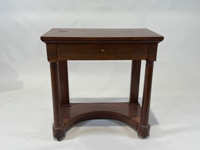 Small console on casters opening to a drawer...