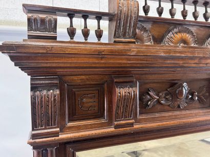 Large molded and carved walnut mirror with...
