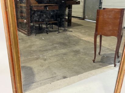 Rectangular glass in wood and gilded stucco.
Late...
