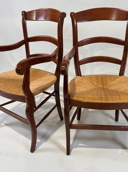 Pair of cherrywood armchairs, straw seat.
20th...
