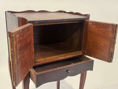 Molded wood bedside table opening with two...