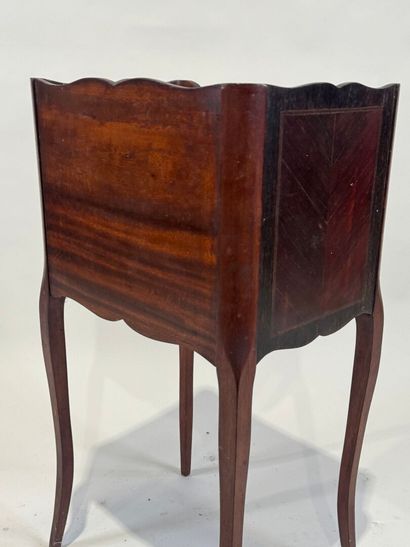 Molded wood bedside table opening with two...