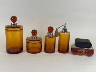 Colored glass and metal toilet set including...