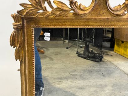 Gilded wood mirror decorated with strings...