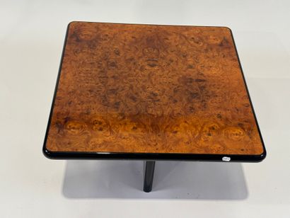 Small square burrwood coffee table, cross-legged.
35...