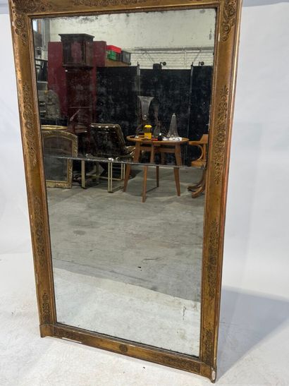 Wood and gilded stucco mirror with foliate...