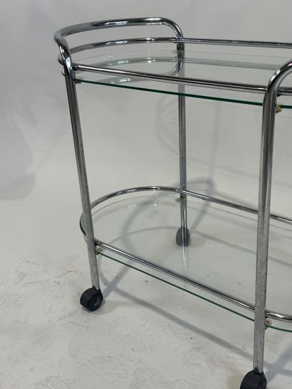 Chromed metal trolley with double glass top.
Work...