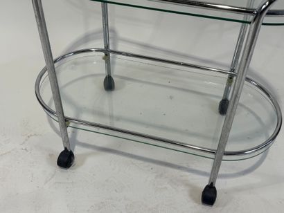 Chromed metal trolley with double glass top.
Work...
