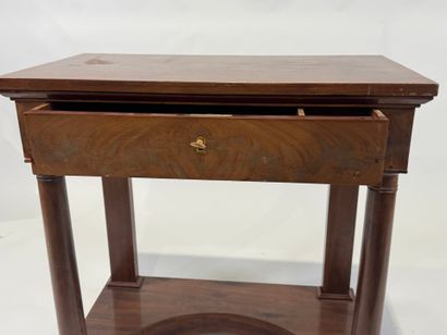 Small console on casters opening to a drawer...