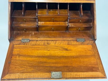 Small wooden sloping desk opening with a...