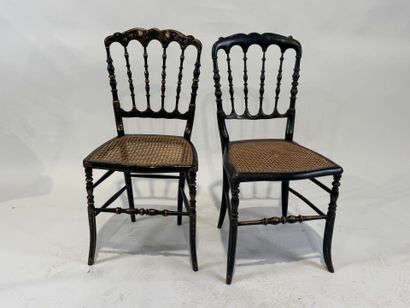 Two chairs in blackened wood with gold highlights,...