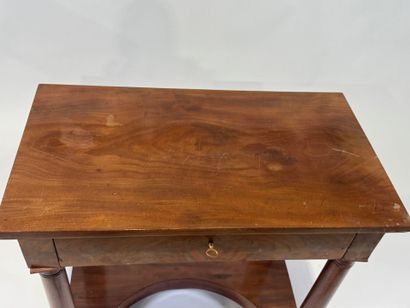 Small console on casters opening to a drawer...