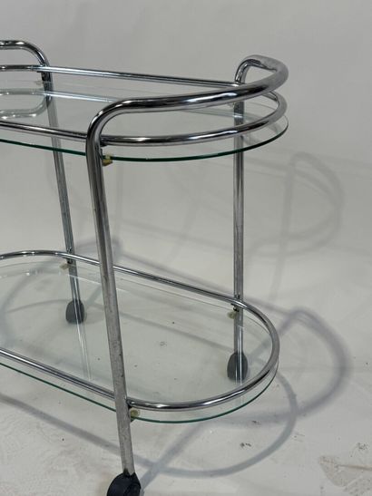 Chromed metal trolley with double glass top.
Work...