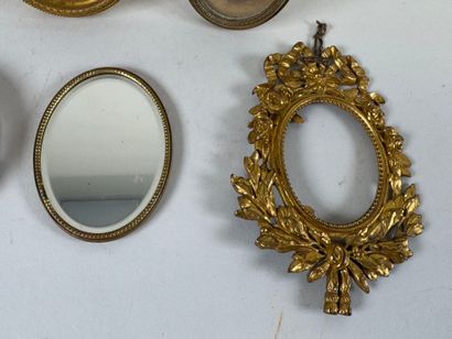 Four small brass picture frames, three with...