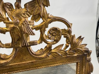 Gilded wood mirror decorated with strings...