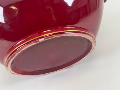 Large earthenware cachepot on a red ground...