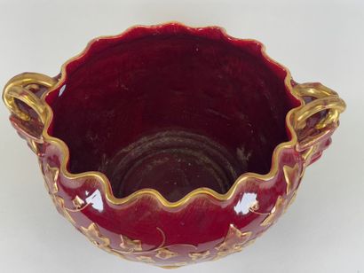 Large earthenware cachepot on a red ground...