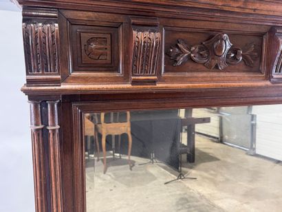 Large molded and carved walnut mirror with...