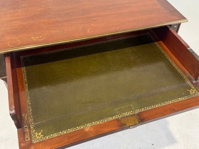 Small mahogany and brass fillet desk on casters,...