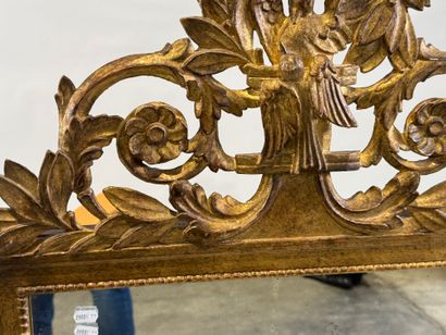 Gilded wood mirror decorated with strings...