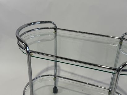 Chromed metal trolley with double glass top.
Work...