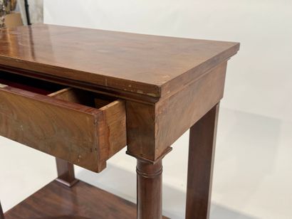 Small console on casters opening to a drawer...