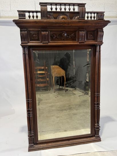 Large molded and carved walnut mirror with...