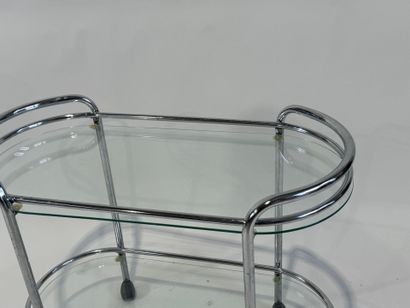 Chromed metal trolley with double glass top.
Work...