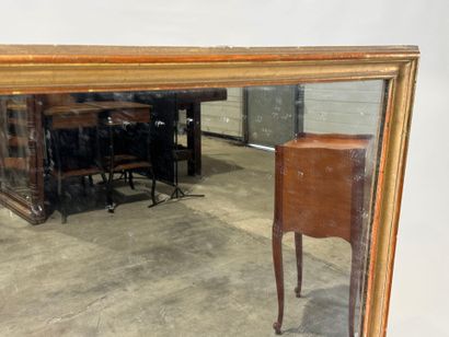 Rectangular glass in wood and gilded stucco.
Late...