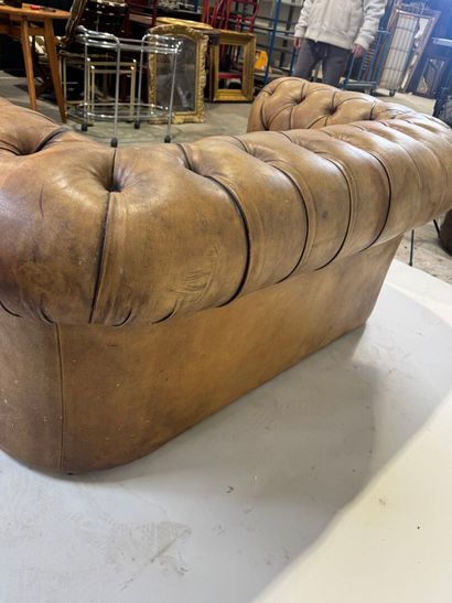 Brown leather Chesterfield sofa.
76 x 170...