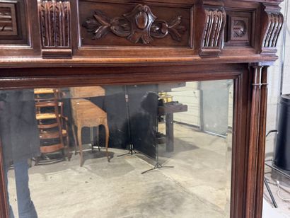 Large molded and carved walnut mirror with...