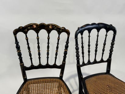 Two chairs in blackened wood with gold highlights,...
