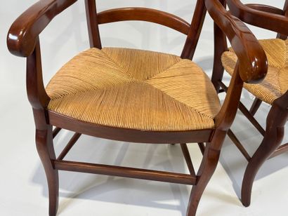 Pair of cherrywood armchairs, straw seat.
20th...