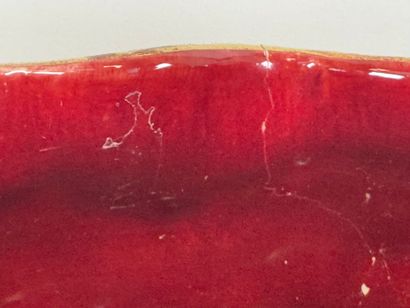 Large earthenware cachepot on a red ground...