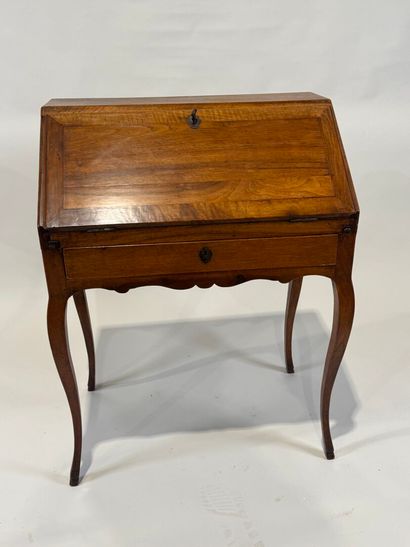 Small wooden sloping desk opening with a...