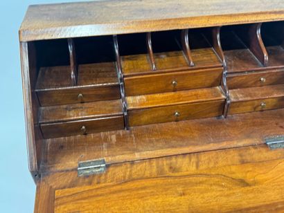 Small wooden sloping desk opening with a...