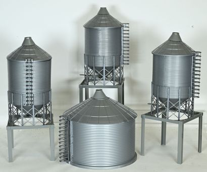 3 gray plastic silos, 3 of which are incomplete,...