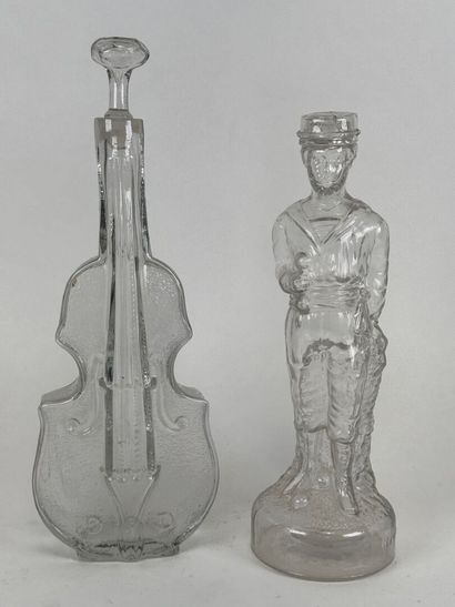 Two glass bottles decorated with a violin...