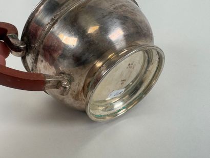 Silver-plated metal teapot, wooden handle.
13...