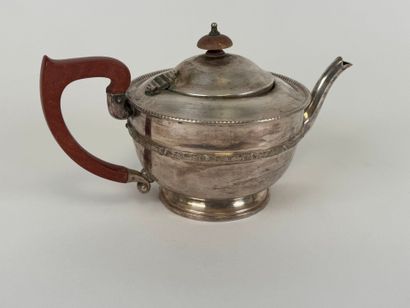 Silver-plated metal teapot, wooden handle.
13...