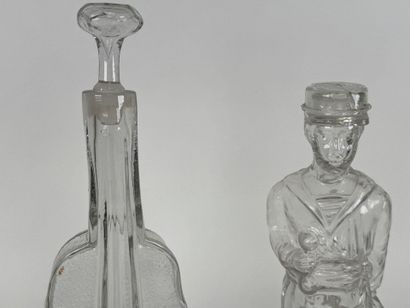 Two glass bottles decorated with a violin...