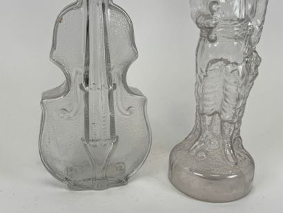 Two glass bottles decorated with a violin...