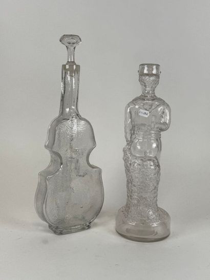 Two glass bottles decorated with a violin...