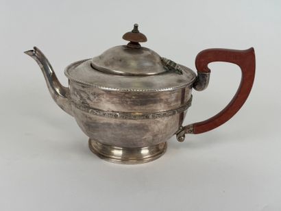 Silver-plated metal teapot, wooden handle.
13...