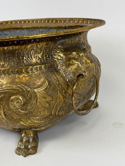 Large jardinière in repoussé brass decorated...