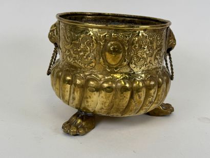 Small circular jardinière in repoussé brass...